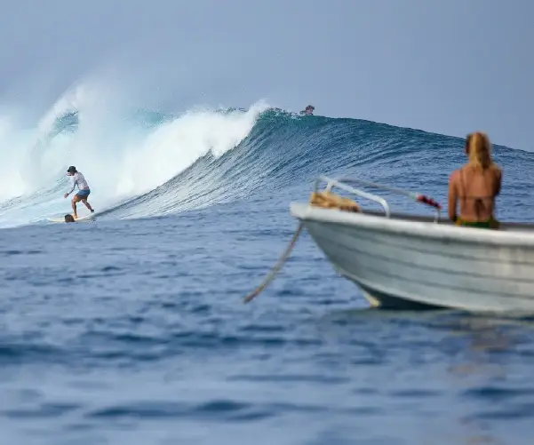 Watching a surfer from the dinghy in the channel