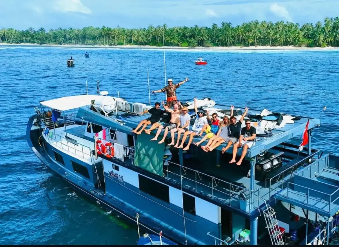 Aerial view of guests waving from the sun deck
